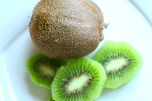 Cold summer desserts: frozen kiwi in chocolate